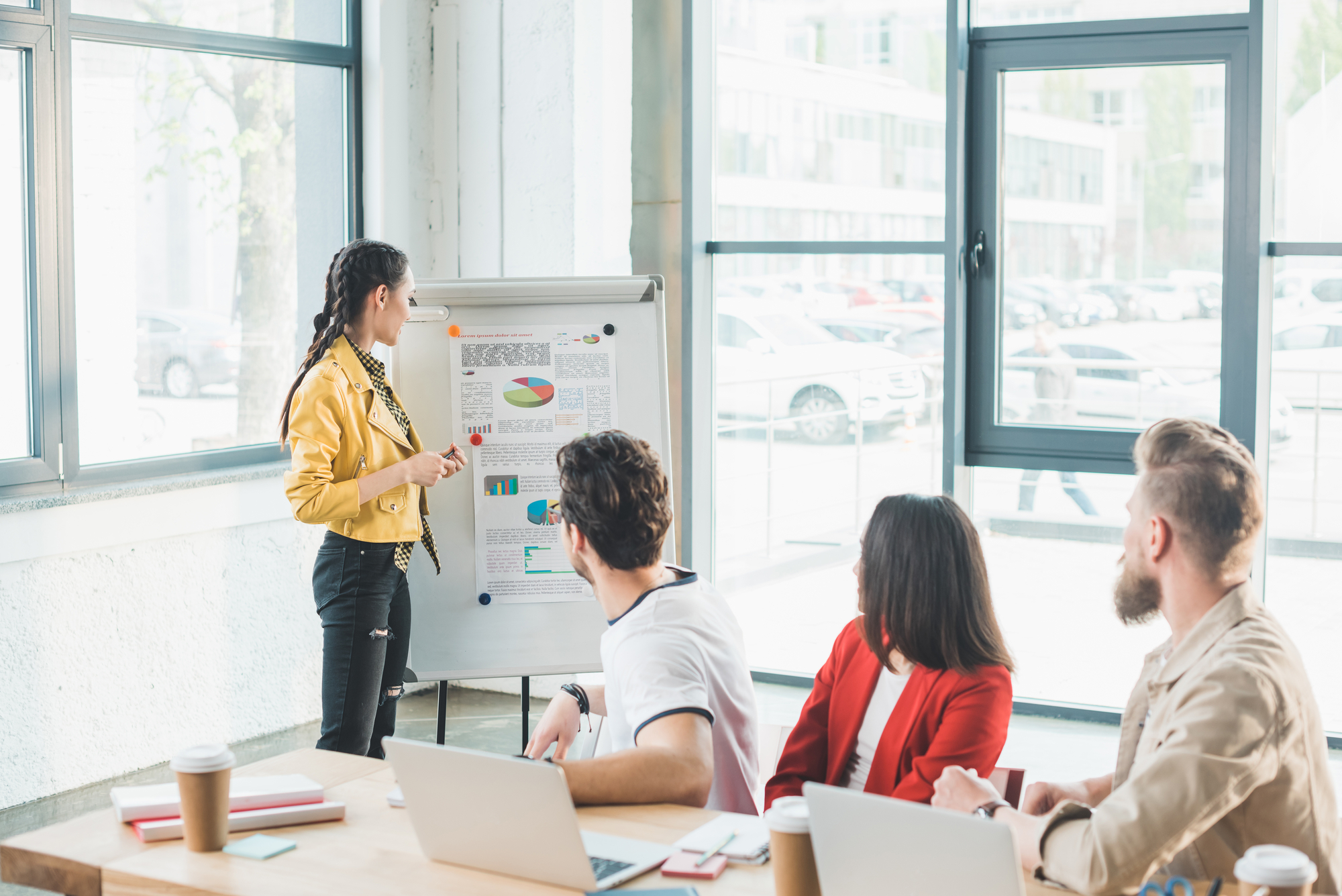 Successful business people looking at woman 